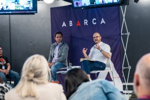 Tony Navarro speaking alongside Jason Borschow during an Oasis Connections Season One session at Abarca Health, with a live audience and virtual participants