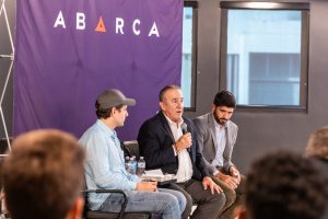 Hon. Manuel Cidre speaking during an Oasis Connections Season One session at Abarca Health, joined by fellow panelists in a discussion on economic development in Puerto Rico