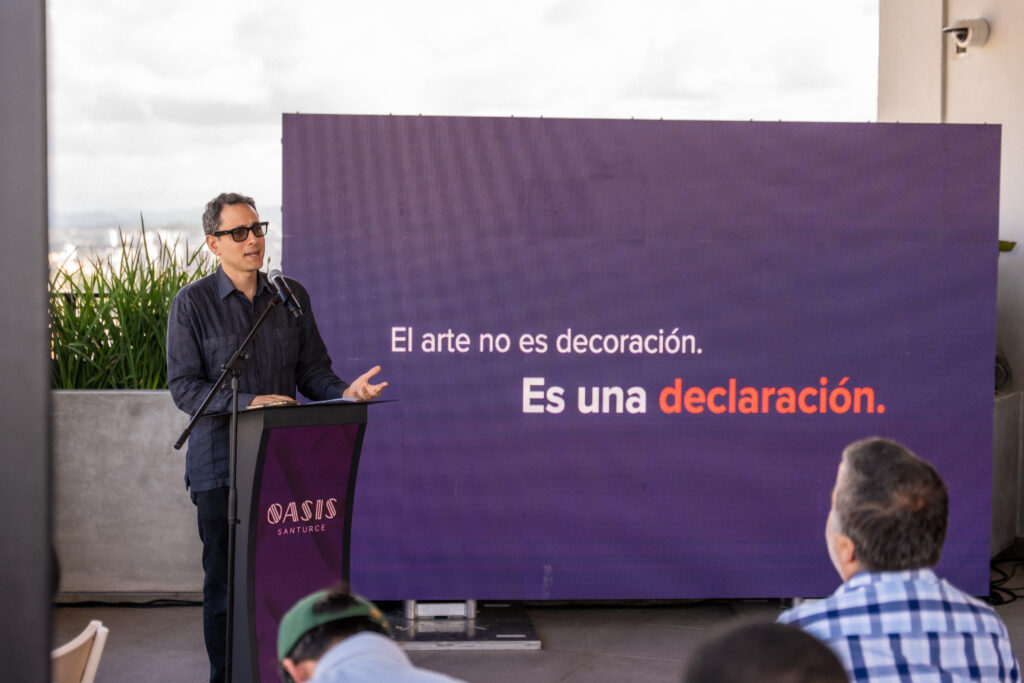 Jason Borschow, CEO of Abarca, speaks at Oasis Santurce during the inauguration of the new façade mural by Puerto Rican artist Bikismo in Santurce, Puerto Rico.